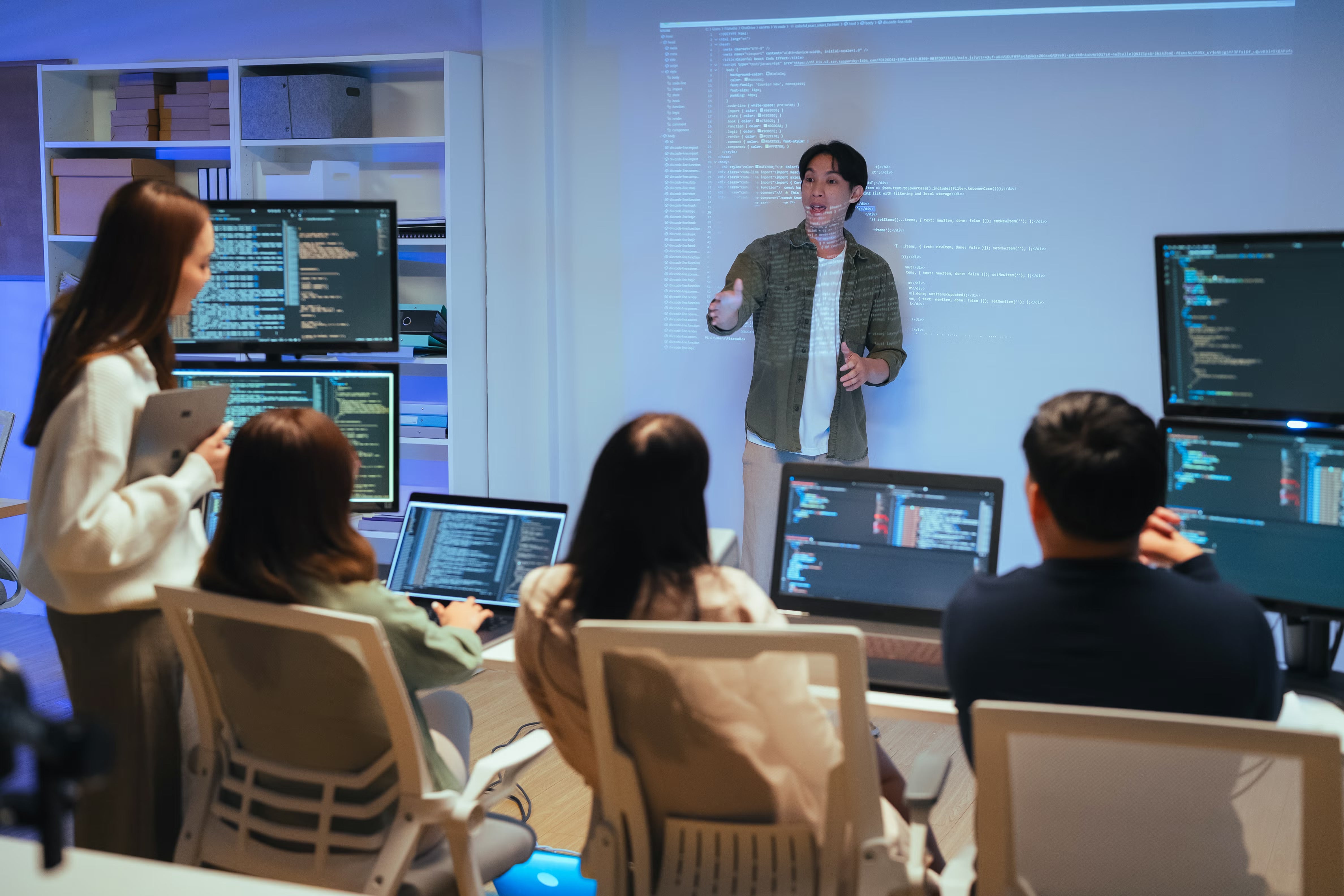 Person giving presentation in front of workshop class