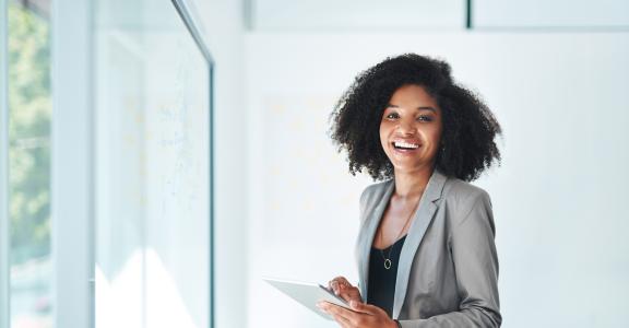 young businesswoman using a digital tablet in an office