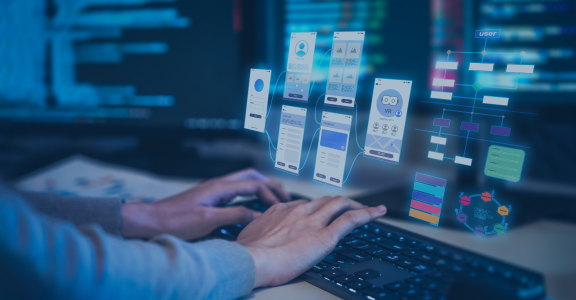 programmer building an app interaction flow with monitors in the back
