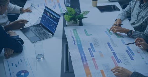 Businesspeople meeting at a conference table collaborating about a project