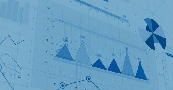 charts of numbers and graphs on a big screen