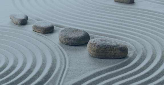 Stones lined up on zen garden
