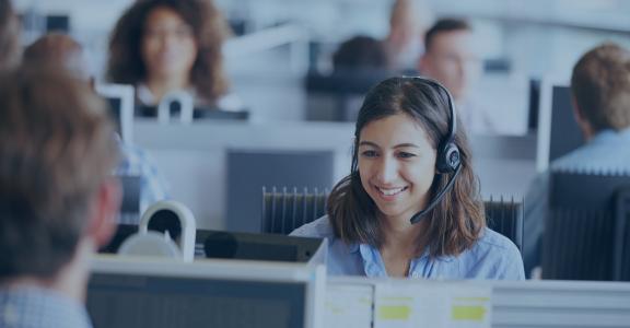 young woman in a call center talking to a customer 