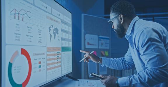 A Man Reviews the data analysis of marketing from social media platforms