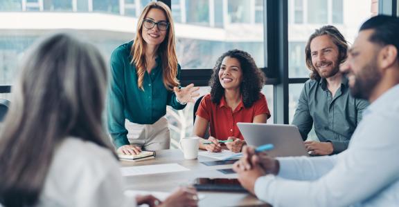 group of young business people talking in a group