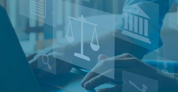 person typing at a laptop