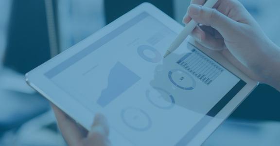 Medical Devices: Person holding a tablet with graphs and cha