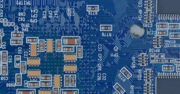 Workshop Series: Dark blue circuit board with many complex n