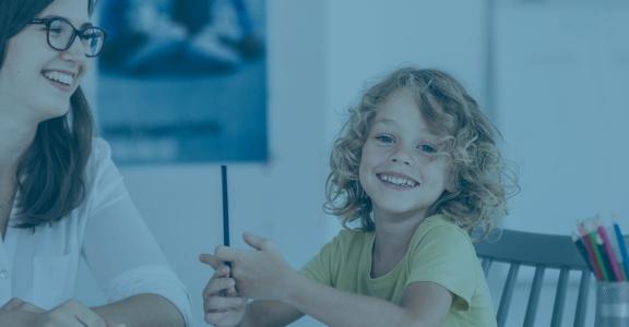 Woman and young girl smiling