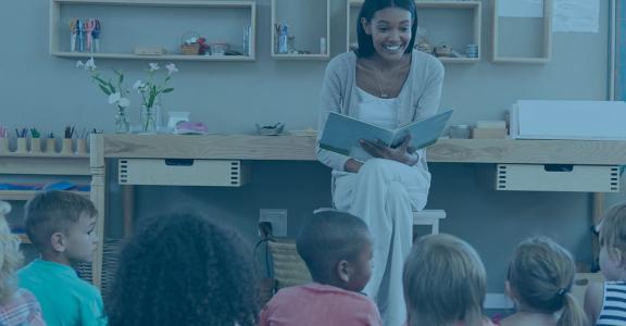 Teacher doing story time with toddlers