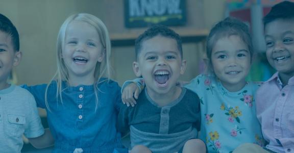 group of toddlers arm and arm