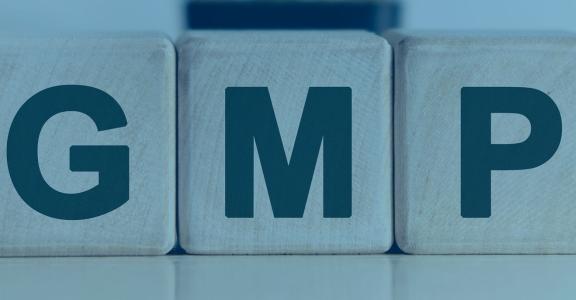 Wood blocks with the letters Gmp