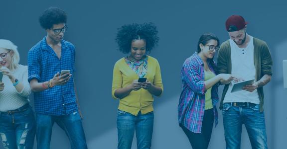 Group of people looking at different mobile electronic devic