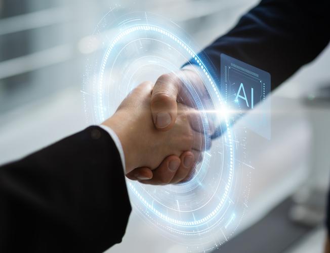handshake with AI diagram over it