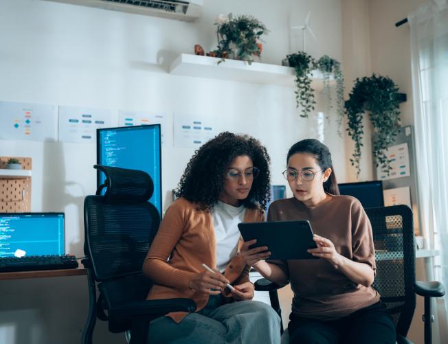 two women discussing project