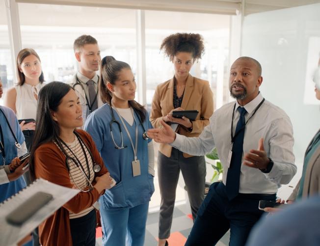 Man, training and mentoring nurses and healthcare staff