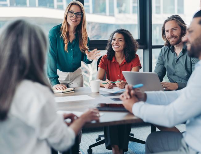 group of young business people talking in a group