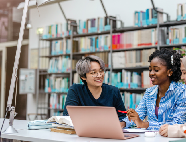 Three multiethnic student studying in library