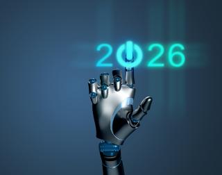 robot hand clicking on a start button which is the "0" in 2026