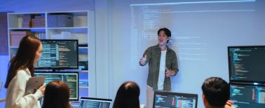 Young entrepreneur reviewing tech project during presentation