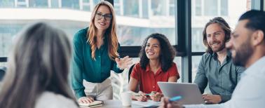 group of young business people talking in a group