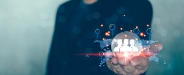 Man in suit holding glass globe with a network structure world map and business digital network technology