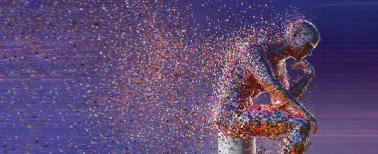 man sitting as particles of his body dissipate.