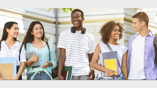 Group of students walking and smiling.